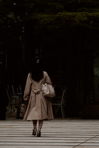 Rear view of man walking on street