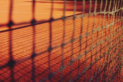 Tennis court seen through net