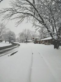 Snow covered landscape against sky