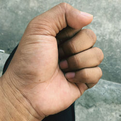 Close-up of person holding hands
