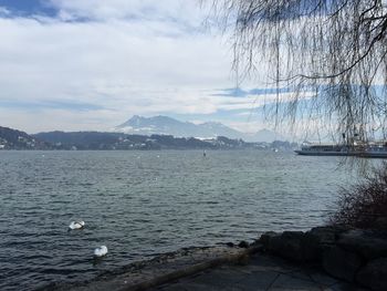 View of lake against cloudy sky