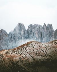 Scenic view of rocky mountains against clear sky