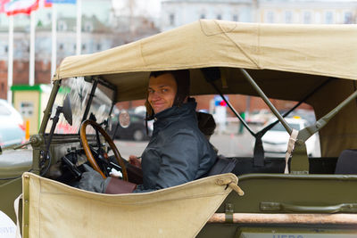 Portrait of a smiling man in city