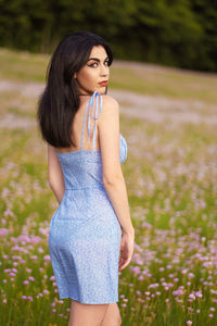 Beautiful woman standing on field