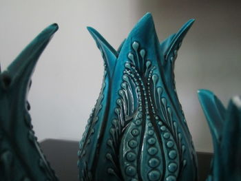 Close-up of black cat on table at home