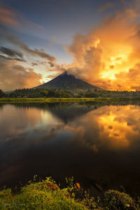 Scenic view of lake against sky during sunset