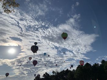 Low angle view of hot air balloons against sky