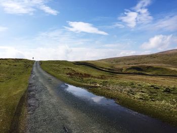 Empty country road along landscape