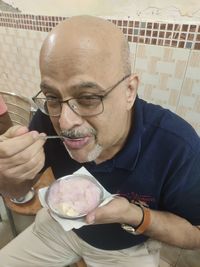 Portrait of man holding ice cream