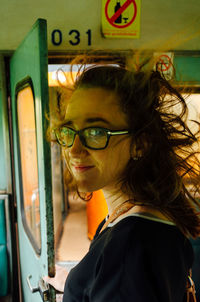 Portrait of smiling woman in car