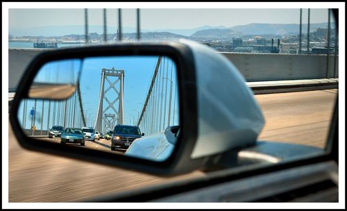 Reflection of car on side-view mirror