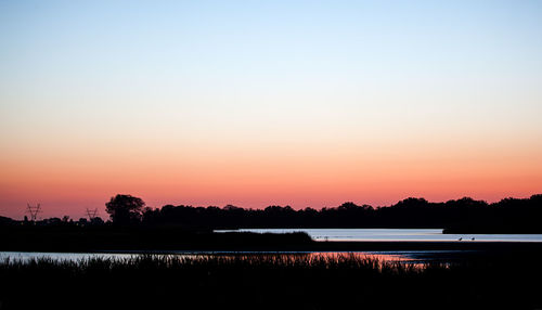 Scenic view of sea at sunset