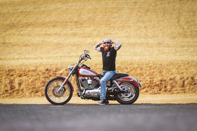 Man riding bicycle on road