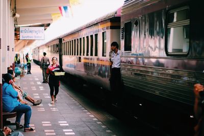 People waiting at railroad station platform