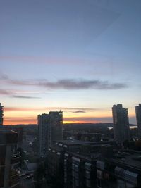 High angle view of buildings against sky during sunset