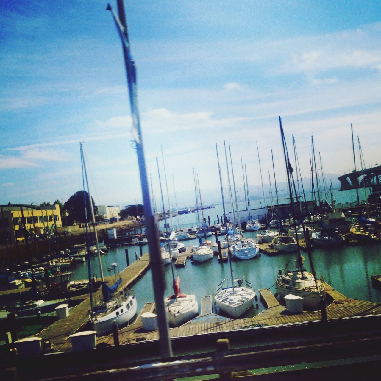 moored, nautical vessel, water, transportation, harbor, boat, mode of transport, sky, cloud - sky, sea, mast, blue, sailboat, marina, cloud, reflection, outdoors, no people, nature, commercial dock