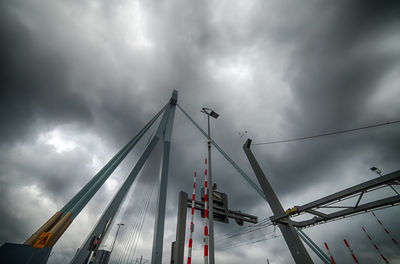 Low angle view of crane against sky