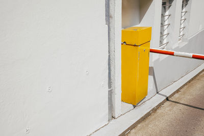 Car park parrier on white wall