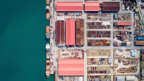 High angle view of commercial dock against blue sky