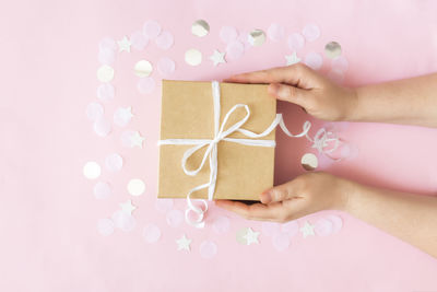 Midsection of woman holding paper in box
