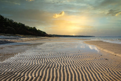 Scenic view of beach during sunset