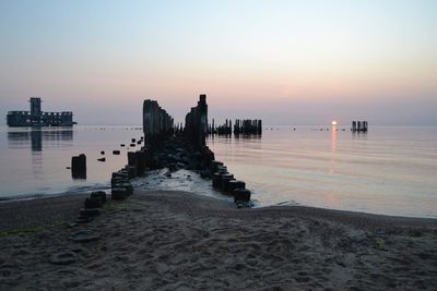 Scenic view of sea against clear sky during sunset