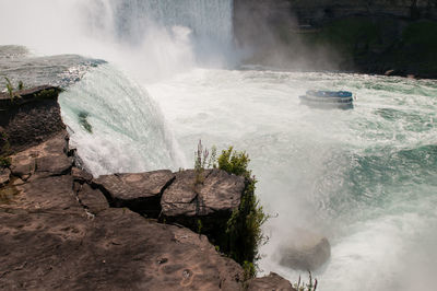 Maid of the mist at the niagara falls, from the us side. water flowing strongly