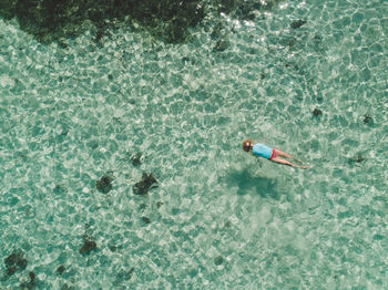 Woman swimming in sea