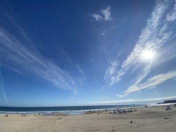 Panoramic view of beach against blue sky