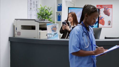 Portrait of female doctor working at home