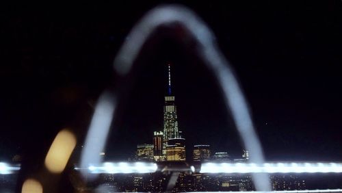 Low angle view of illuminated city at night