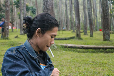 Side view of man looking at park