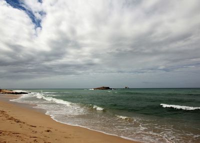 Scenic view of beach against sky