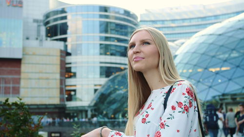 Beautiful smiling woman standing outdoors