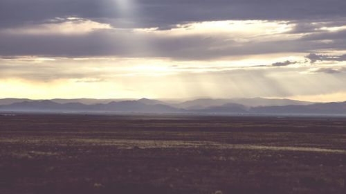 Scenic view of landscape against cloudy sky