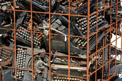 High angle view of bottles on shelf in building