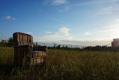 Abandoned house on field against clear sky