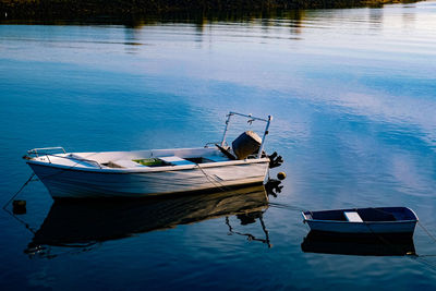 Boat moored at lake