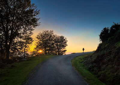 Scenic view of field against sky during sunset