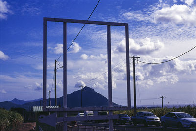 Low angle view of road against cloudy sky