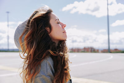 Portrait of young woman looking away