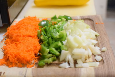 High angle view of chopped vegetables in plate on table