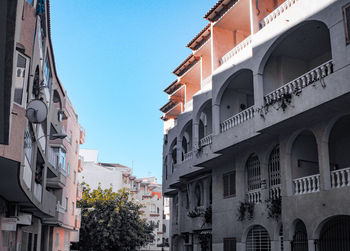 Low angle view of buildings against blue sky