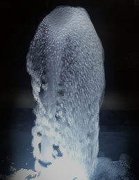 Close-up of water splashing against black background