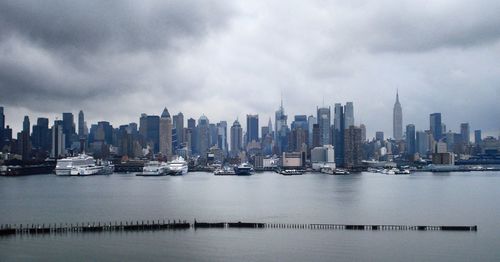 Panoramic view of buildings in city against sky