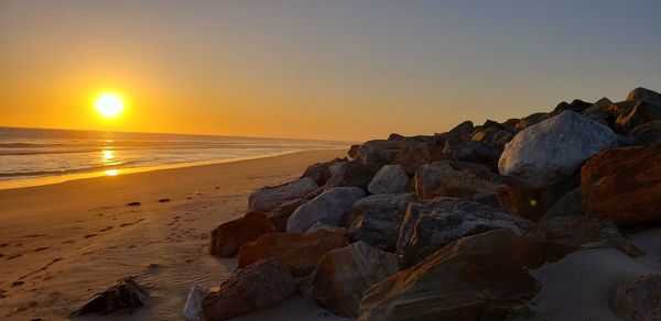 Scenic view of sea against sky during sunset