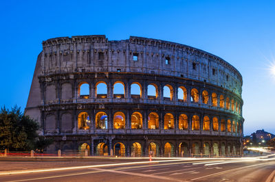 Colosseum against blue sky at rome