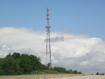 Low angle view of electricity pylon against sky