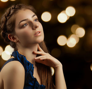 Portrait of young woman looking away