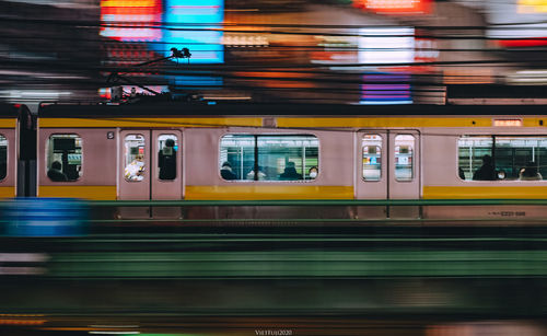 Train at railroad station in city